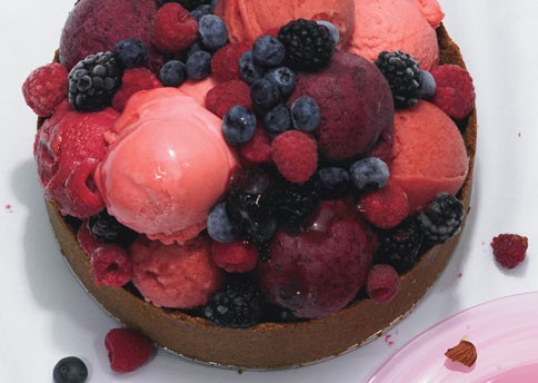 Lime ice cream torte topped with berry sorbets