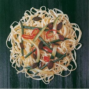 Linguine tossed with courgettes, pumpkin seeds and green beans