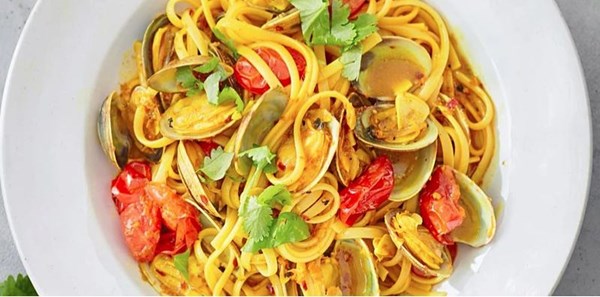 Linguine with clams, turmeric and coriander