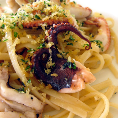 Linguini with grilled baby octopus and herbed bread crumbs