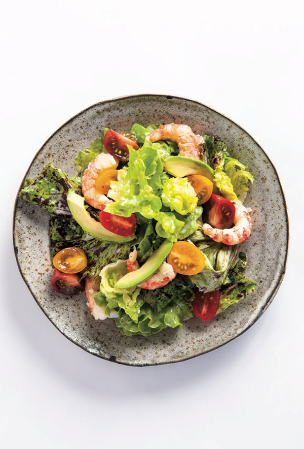 Little gem lettuce with green goddess dressing, cherry tomatoes, avocado, and spot prawns