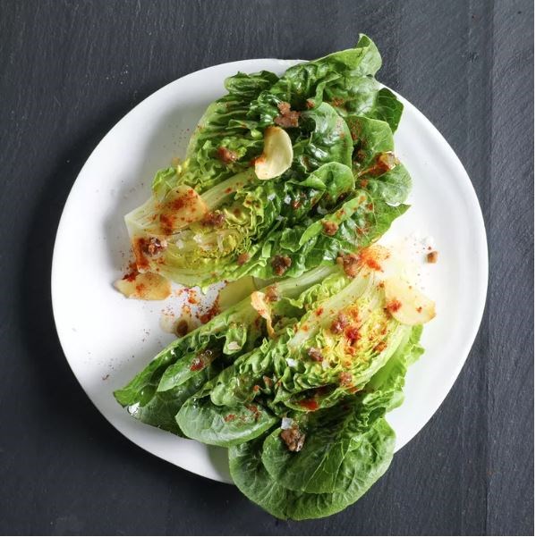 Little gems with warm garlic dressing