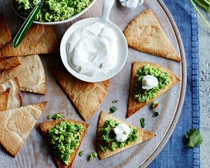 Little tortilla chips with pea guacamole