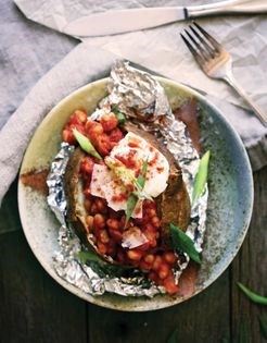 Loaded baked potatoes with baked beans and the works