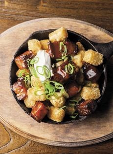 Loaded tater tots with BBQ bacon, BBQ sauce, and cheese