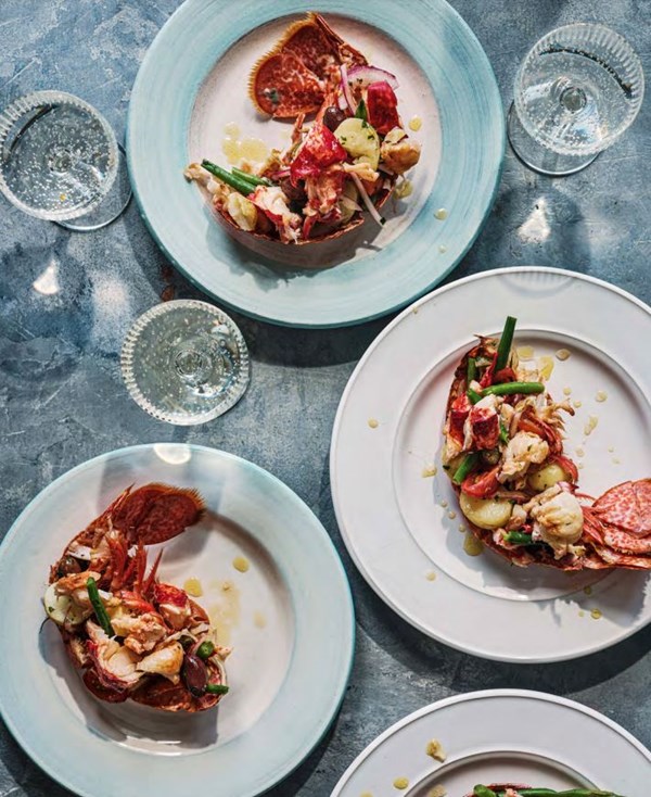 Lobster Catalan-style with cherry tomatoes and red onions (Aragosta alla Catalana)