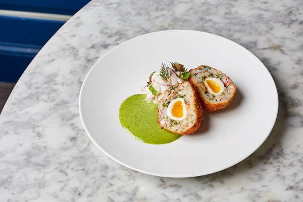 Lobster scotch egg with celeriac slaw and lovage mayonnaise