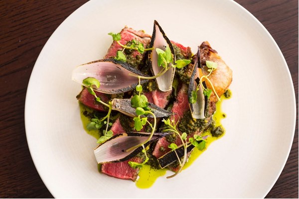 Longhorn beef sirloin, pickled walnut salsa verde & Tropea onions [Merlin Labron-Johnson]