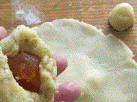Lotus, pine nut & salted yolk filling [for mooncakes] (Liánróng sōngzi dànhuáng / 蓮蓉松子蛋黃)