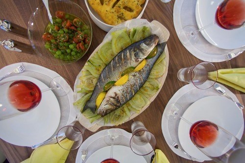 Loupe de mer on herbes de Provence citrus salt, fennel and grape sauce vierge