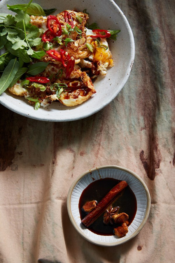 Lucky’s fried eggs with herb salad and caramel spiced soy sauce