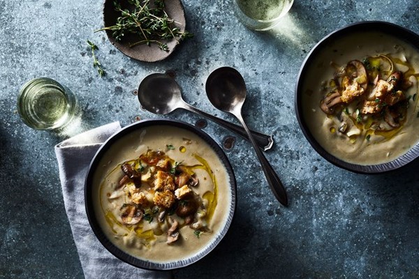 Luxurious cream of mushroom soup with garlic-herb croutons