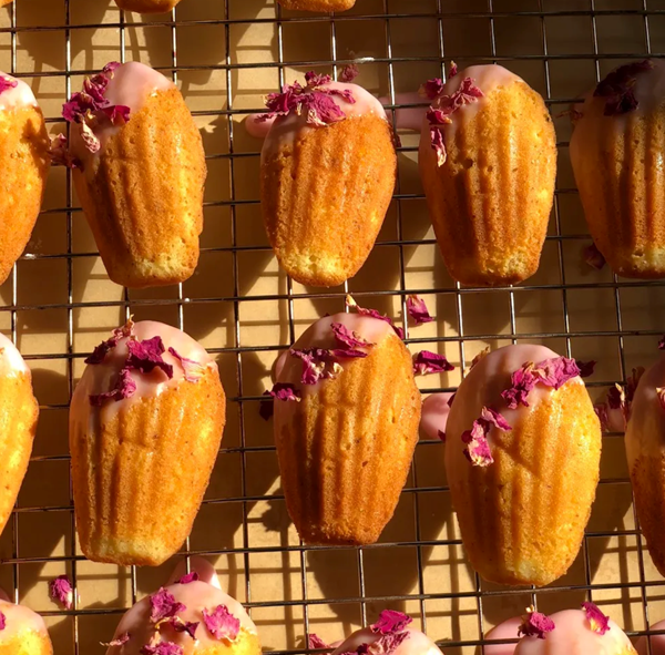 Lychee madeleines with hibiscus tea glaze & dried rose petals