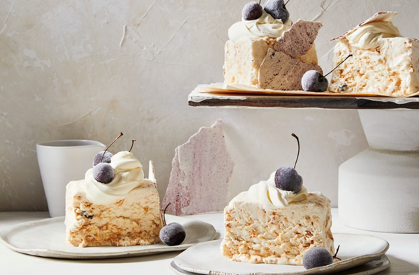 Macadamia meringue ice cream with cherry mulled wine sauce