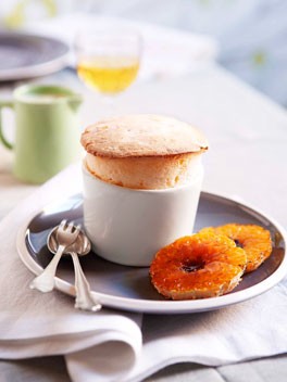 Mandarin soufflé with white chocolate sauce