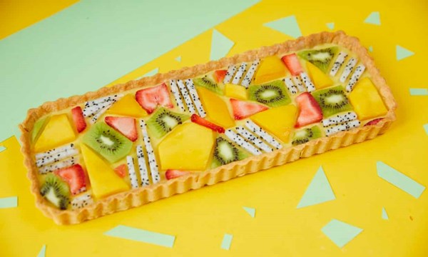 Mango and coconut tart with geometric fruit pieces