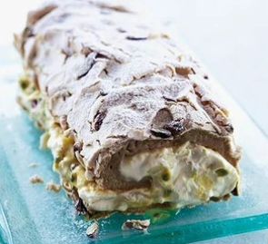 Mango and passion fruit Pavlova roulade