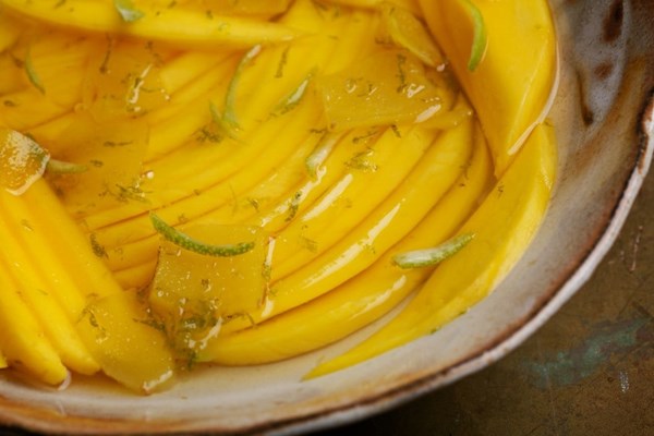 Mango cheeks in lime and ginger syrup