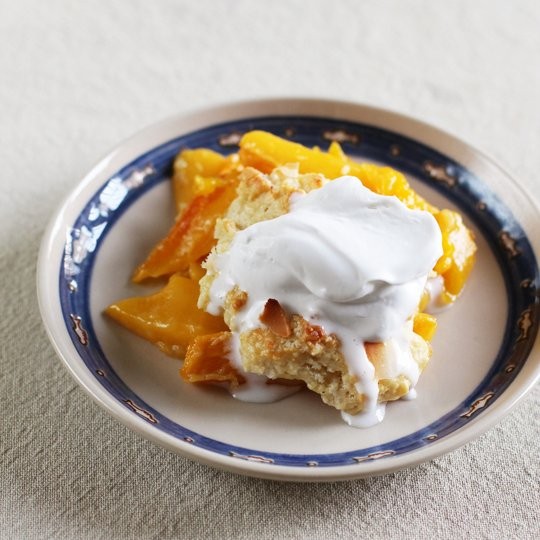 Mango cobbler with coconut whipped cream
