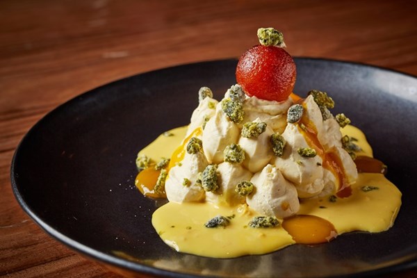 Mango shrikhand with rasmalai sauce and pistachio crumble