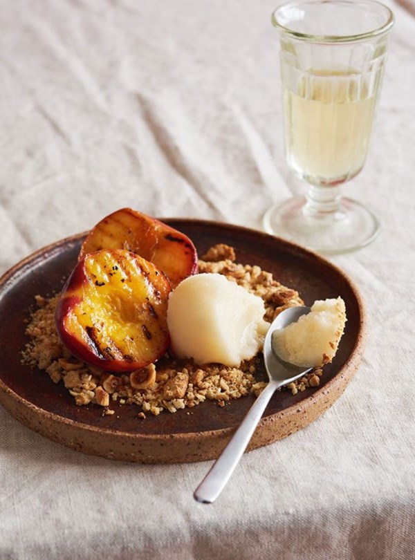 Manuka honey sorbet with grilled peaches & hazelnut oat granola crumb