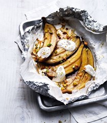 Maple and rum baked bananas with toasted hazelnuts and pistachios