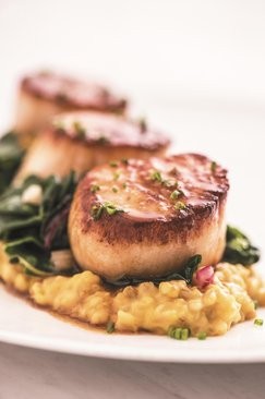 Maple-bourbon-glazed scallops with butternut squash and Swiss chard