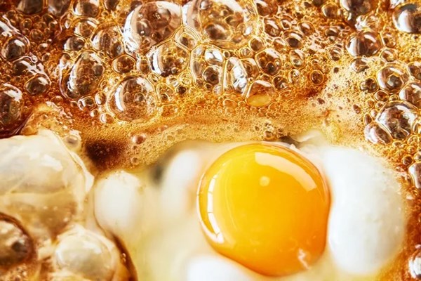 Maple-fried egg and sausage biscuit