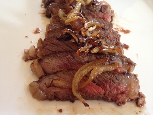Maple-ginger glazed rib eye steak with maple caramelized onions