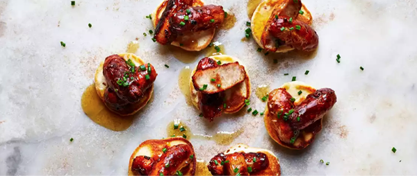 Maple-glazed sausage blinis