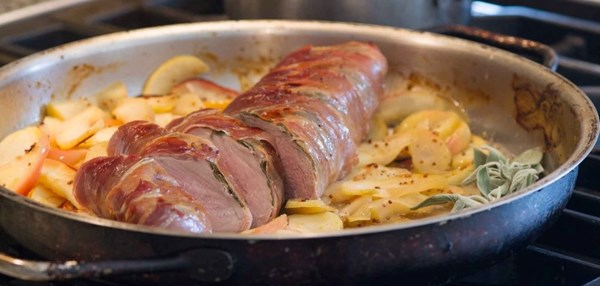 Margie's pork tenderloin saltimbocca roasted on a bed of braised apples