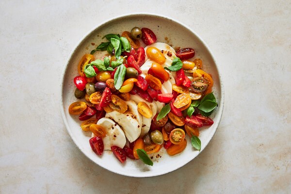 Marinated mozzarella, olives and cherry tomatoes 