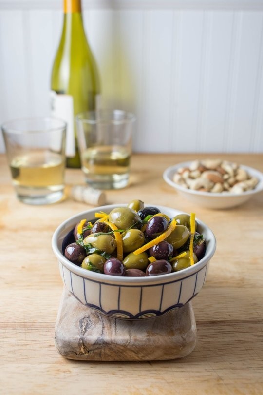 Marinated olives with basil and orange peel