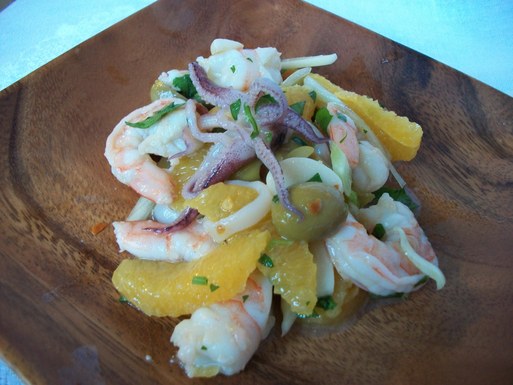 Marinated seafood salad with orange and olive