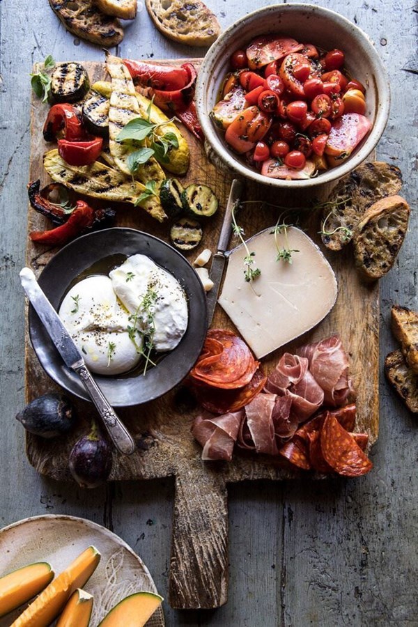 Marinated tomato and grilled veggie cheese board