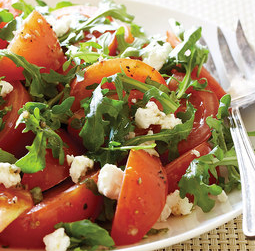Marinated tomato salad with arugula and goat cheese