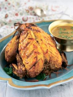 Marinated whole chicken with lamb stuffing