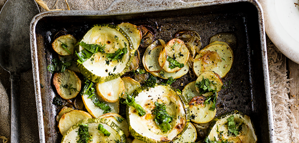 Marrow, potato and shallot bake with smashed garlic and soft herbs