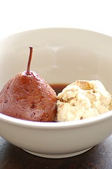 Marsala poached honey pears with brown bread icecream