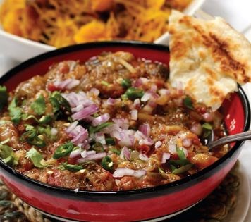 Mashed eggplant with red onions and chilies (Baigan bhartha)