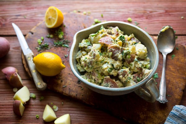 Mashed potato salad with scallions and herbs