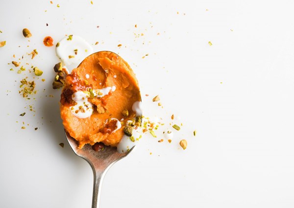 Mashed sweet potatoes with harissa and pistachios