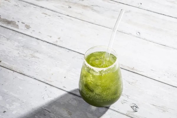 Matcha and honey spritz with crushed almond sugar