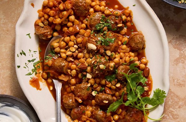 Meatballs in spiced tomato sauce with herby couscous