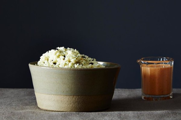 Mediterranean cauliflower rice with smoky red pepper sauce