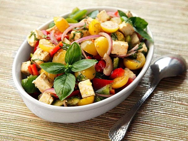 Mediterranean chopped salad with tomatoes, peppers, feta, and basil
