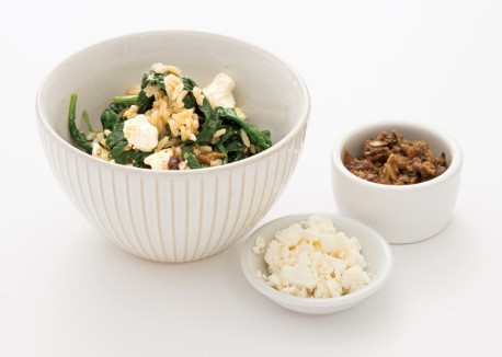 Mediterranean rice with wilted spinach and feta