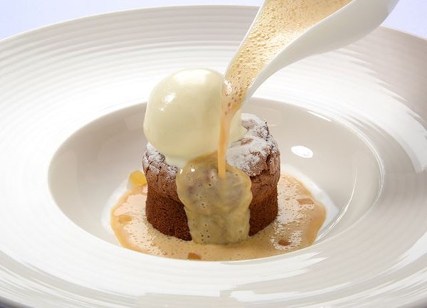Melting ginger pudding with iced double cream and caramel custard