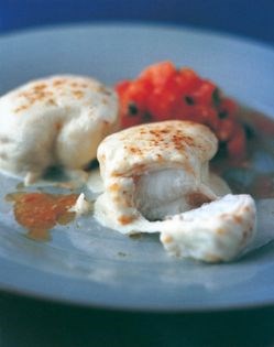 Melting mozzarella monkfish steaks with tomato and basil