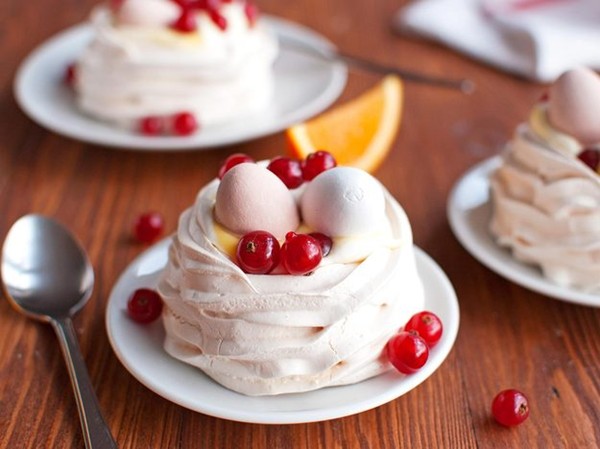 Meringue nests with orange curd cream and Easter eggs